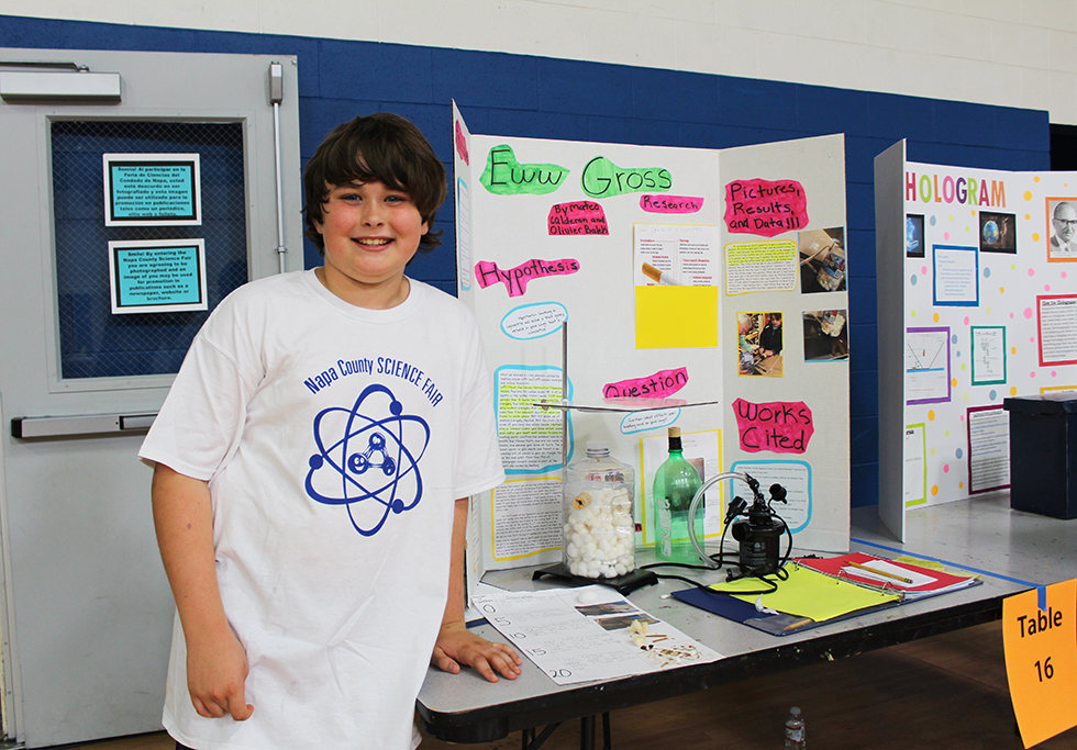 Middle School Boy with Science Fair Project